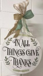 Door Hanger $45 *Bow is not included in the price but can be added on at the event for an additional cost.