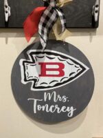 Door Hanger $45 *Bow is not included in the price but can be added on at the event for an additional cost. **For this Door Hanger please provide the following information at checkout: Name as you would like it to read.