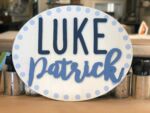 Oval Wood Wall Hanging **In order to have the 3D elements and name cut and ready for your event, this must be ordered 2 weeks in advance and you must contact us by phone or email before you order. Please submit the following with this design: Name