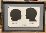 14x24 Framed Double Silhouette- $75 During checkout, please attach a clear side view photo of both of your family members on a plain, preferably white, background (only 1 photo may be uploaded at checkout). Don't forget to provide the names and year photo was taken in the project detail box.