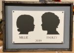 14x24 Framed Double Silhouette- $75 During checkout, please attach a clear side view photo of both of your family members on a plain, preferably white, background (only 1 photo may be uploaded at checkout). Don't forget to provide the names and year photo was taken in the project detail box.